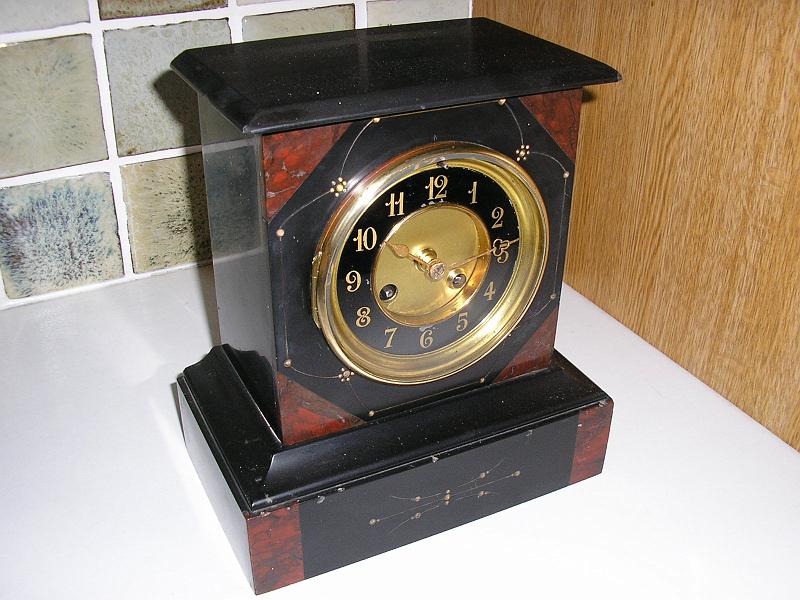 P1060004.JPG - A clean, service plus a new Suspension Spring brought this little Slate Clock to life.