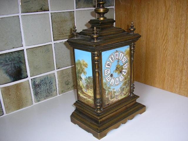 P7020010.JPG - A brass & Gilt French timepiece with hand painted panels.  Two small adjustments will keep it reliably running.