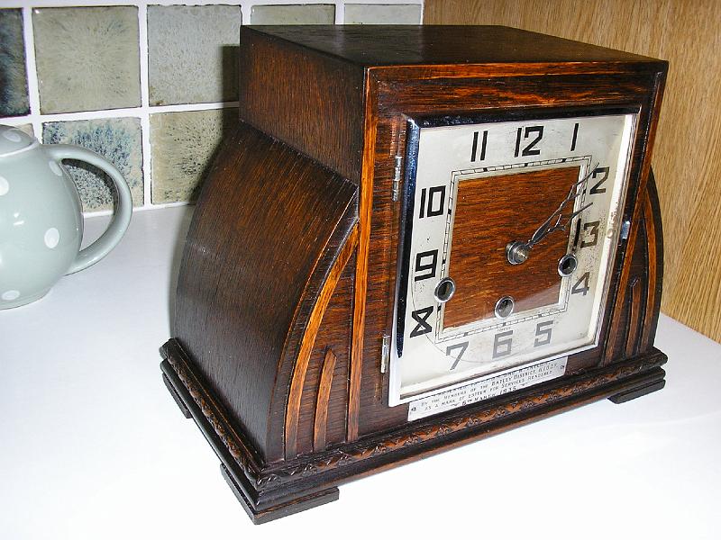 PC200002.JPG - All shapes & Sizes. This clock was awarded for past services in 1934.A new Mainspring, Suspension Spring together with a complete clean & lubrication has returned this family heirloom to working order.